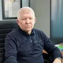 Николай Алексеевич Бобровский за рабочим столом, портрет по грудь